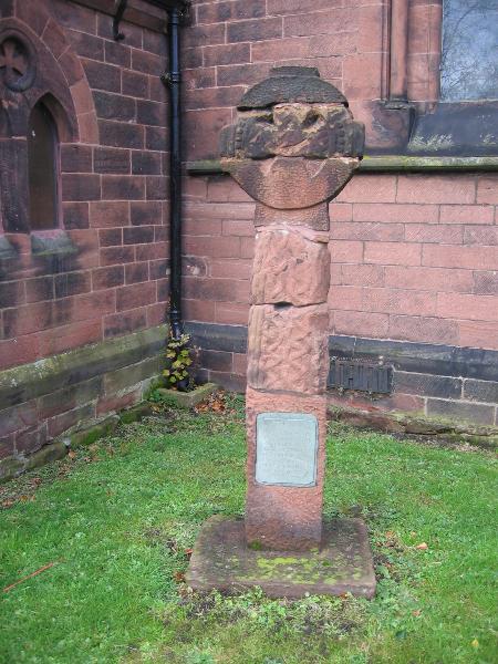 The ancient Saxon Cross in the gardens